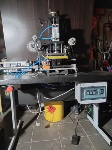 Hot-printing machine for applying hot-melt adhesive to plastic parts